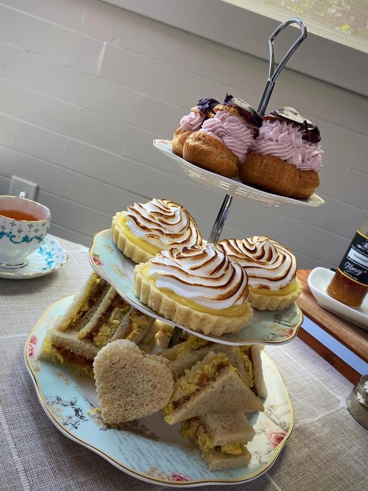 Afternoon tea table set in the countryside garden